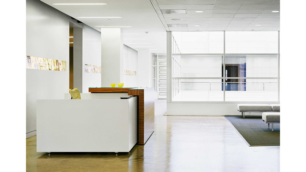 A room with a white table and chairs.