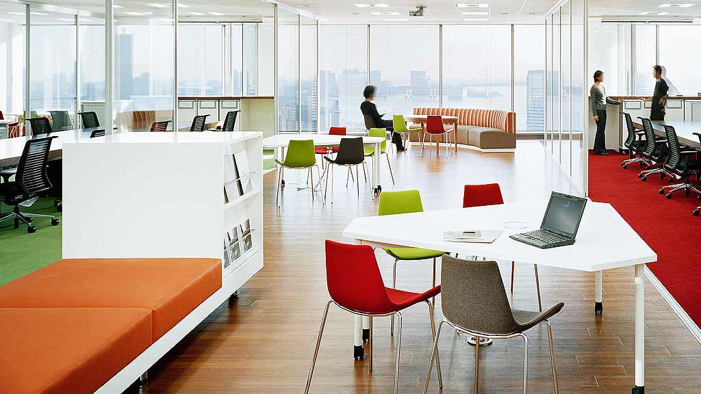 A room with tables and chairs.