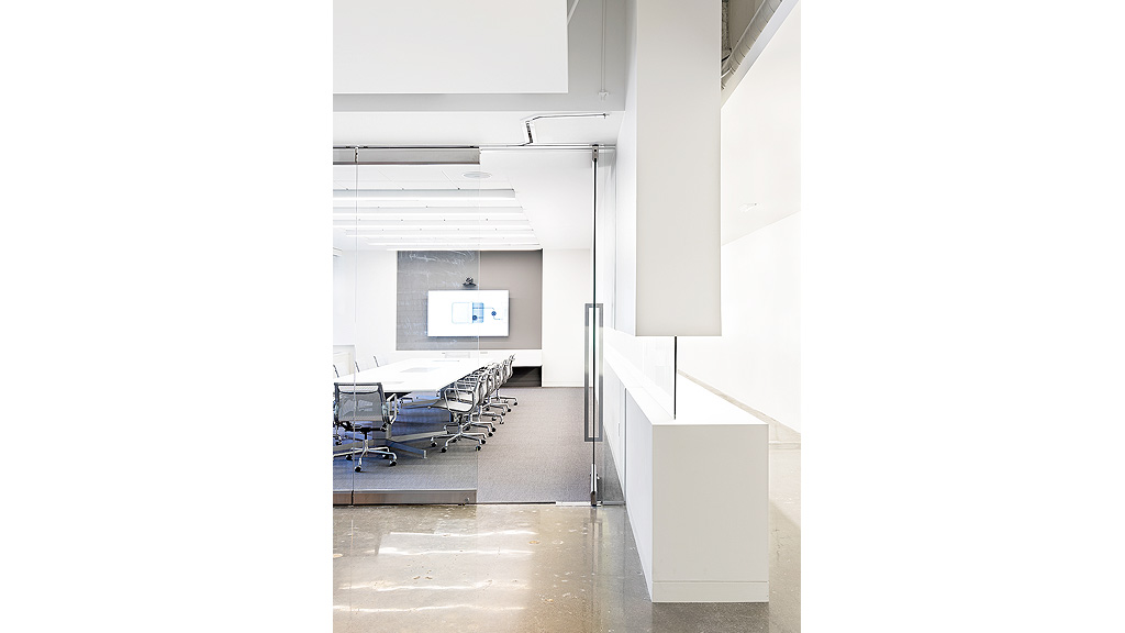 A room with a white wall and a white floor with a white wall.