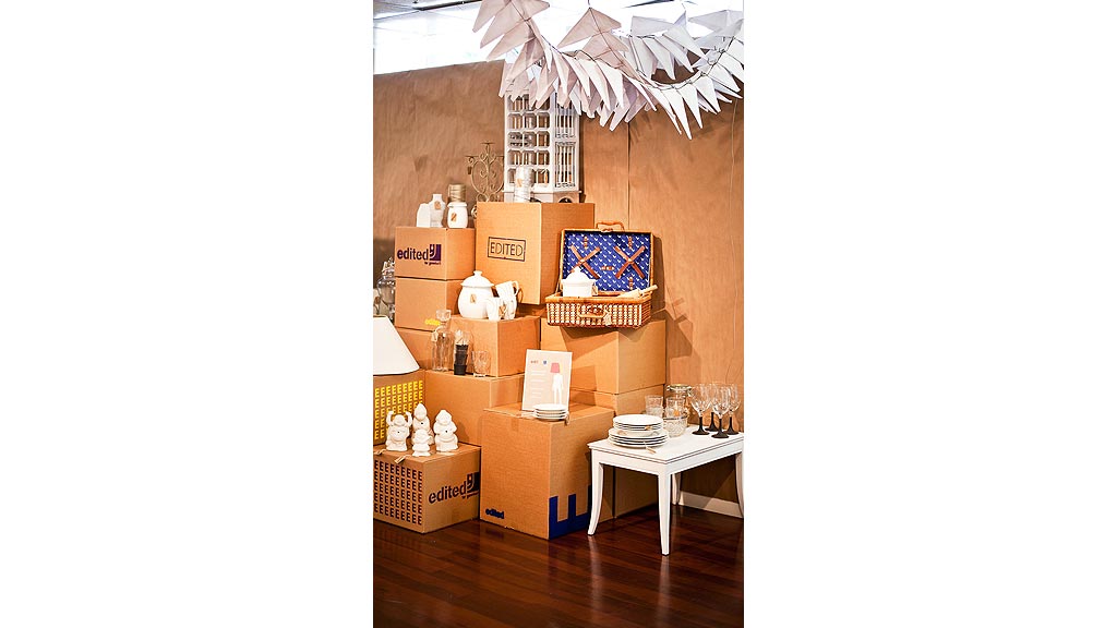 A room with boxes and a table.