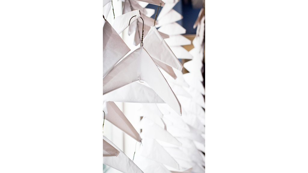 A group of white paper airplanes.