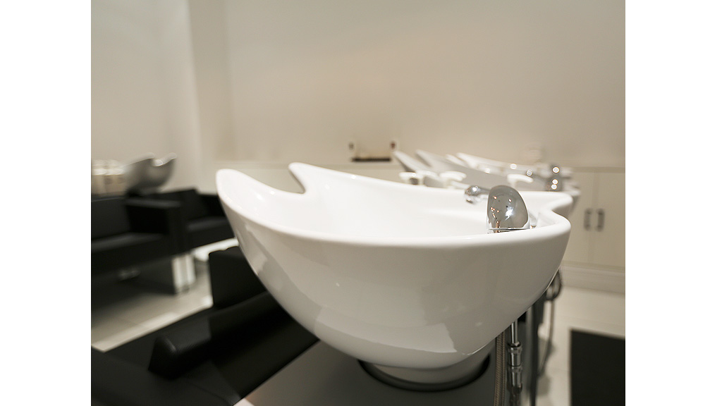 A white bathtub in a bathroom.