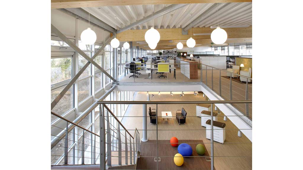 A room with a glass ceiling and a few tables and chairs.