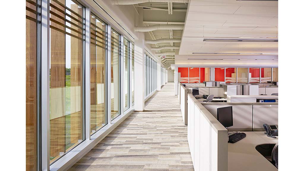 A long hallway with glass doors.