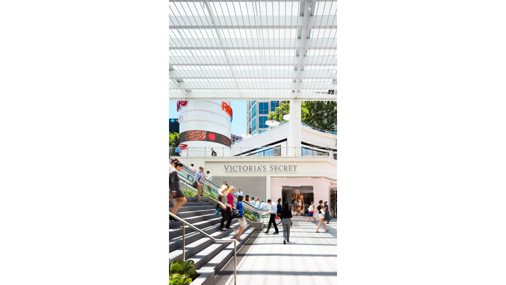 A group of people walking inside a building.