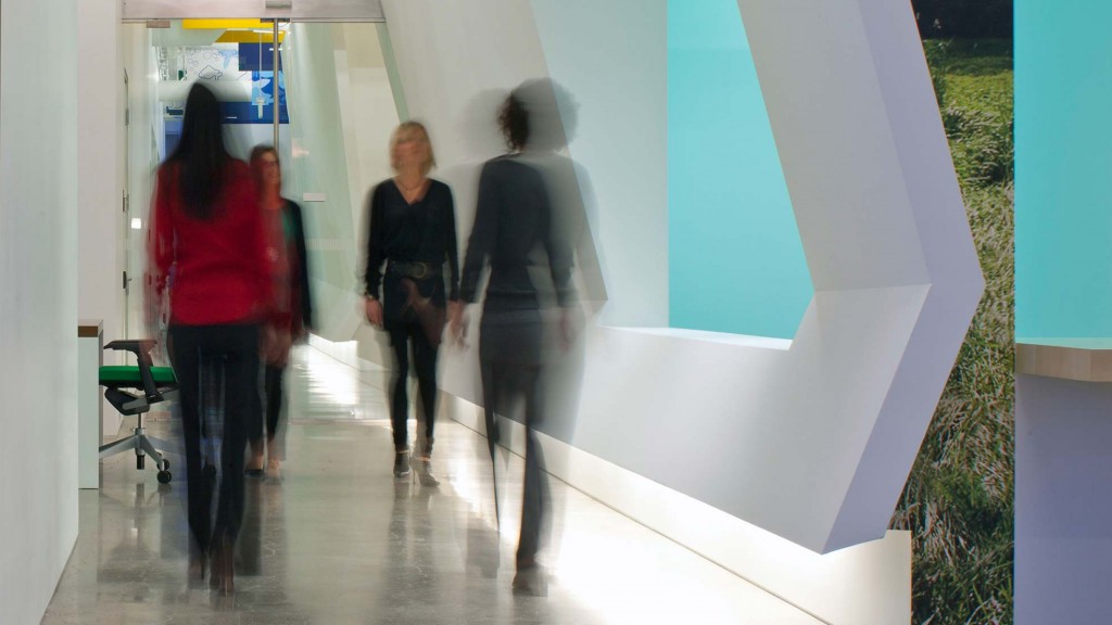 A group of people walking through a building.