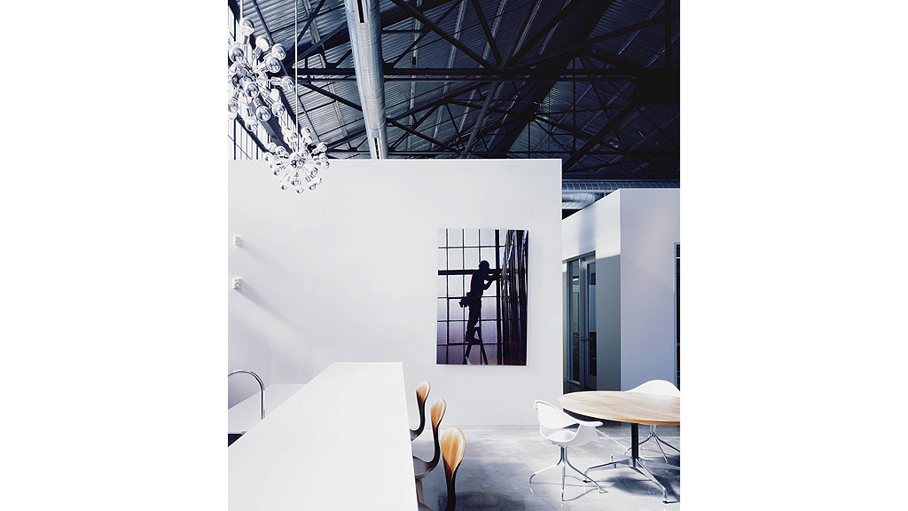 A room with tables and chairs.