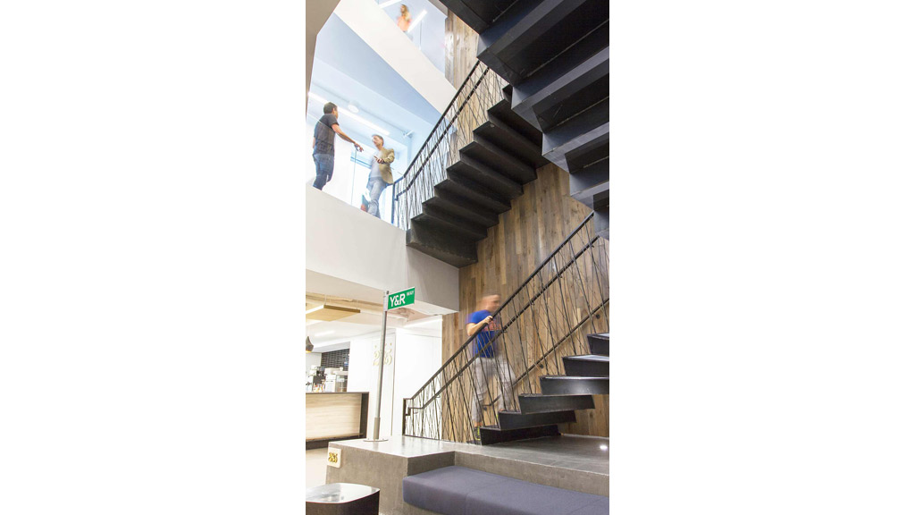 People walking up a staircase.