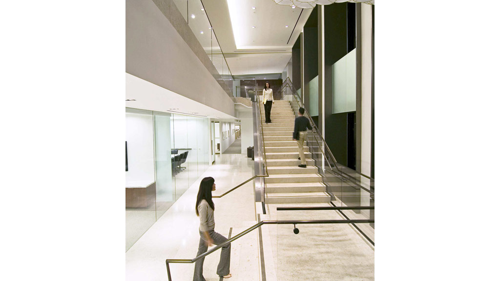 People walking down a flight of stairs.