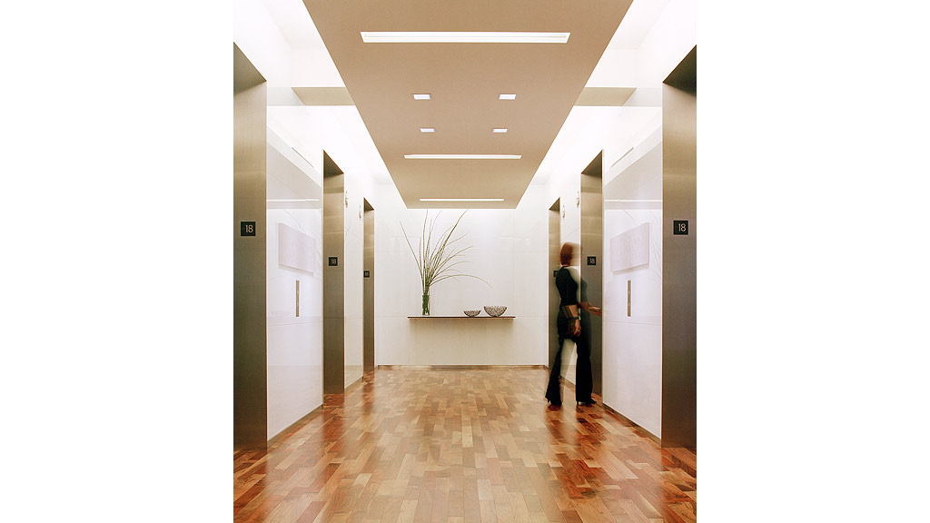 A person standing in a hallway.