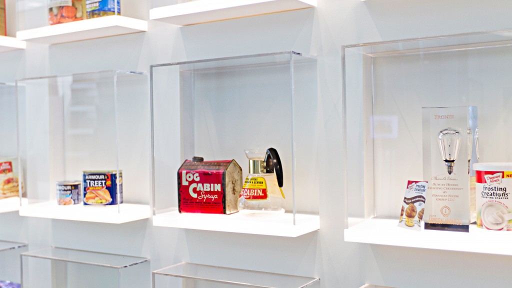 A white refrigerator with shelves full of food and items.