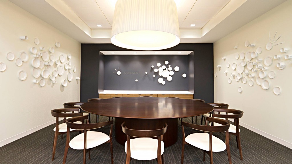 A room with a table and chairs.