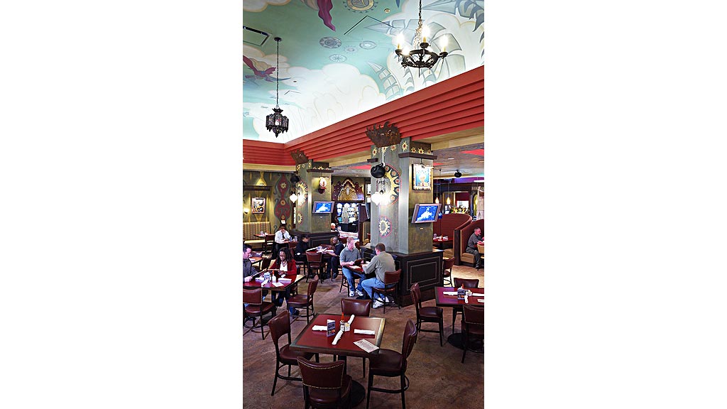 People sitting at tables in a restaurant.