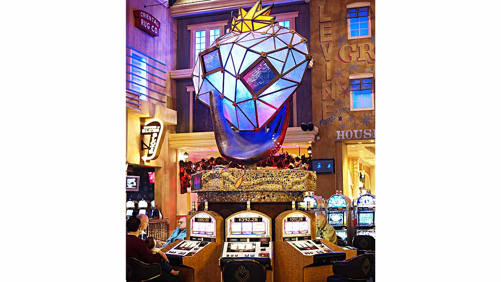 A room with a stage and a large screen.