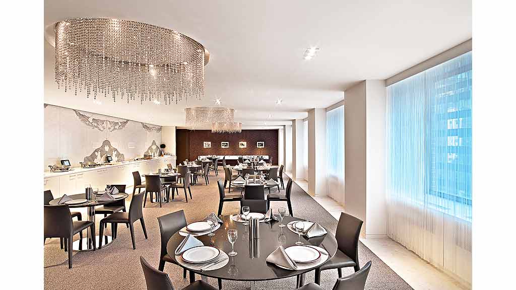 A large room with tables and chairs.