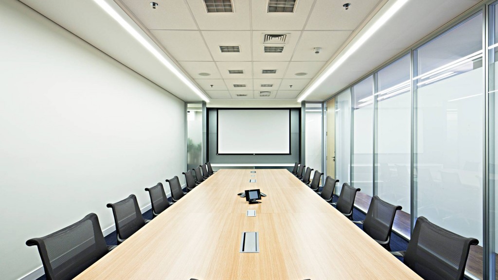 A conference room with a large table.