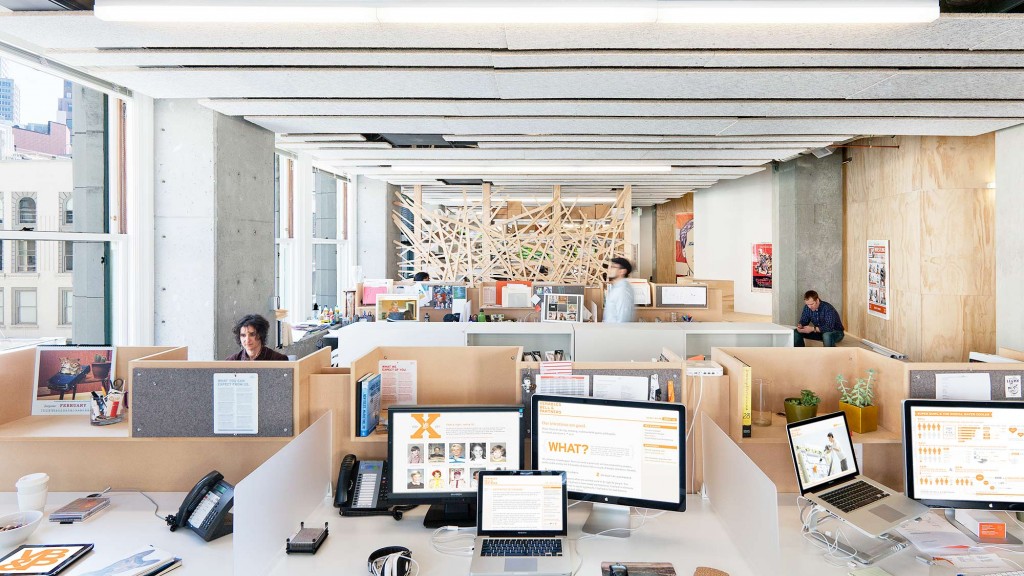 A room with computers and people.