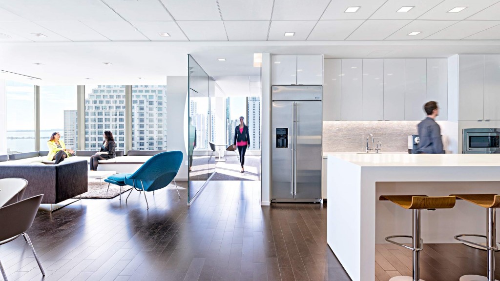 A large kitchen with a large glass wall.