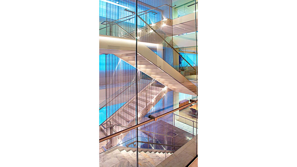 A large glass building with a staircase.