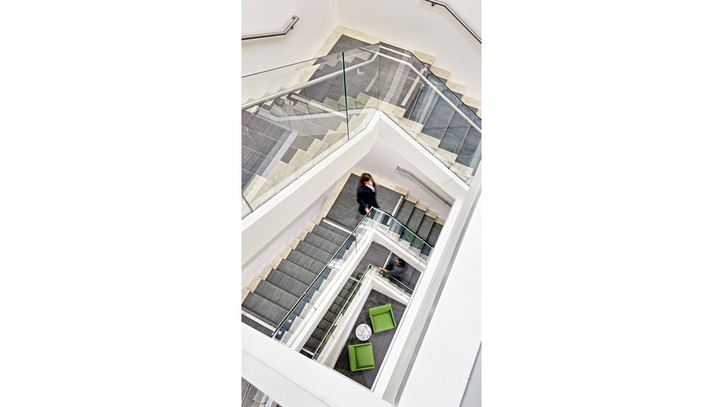 A person walking up a staircase.