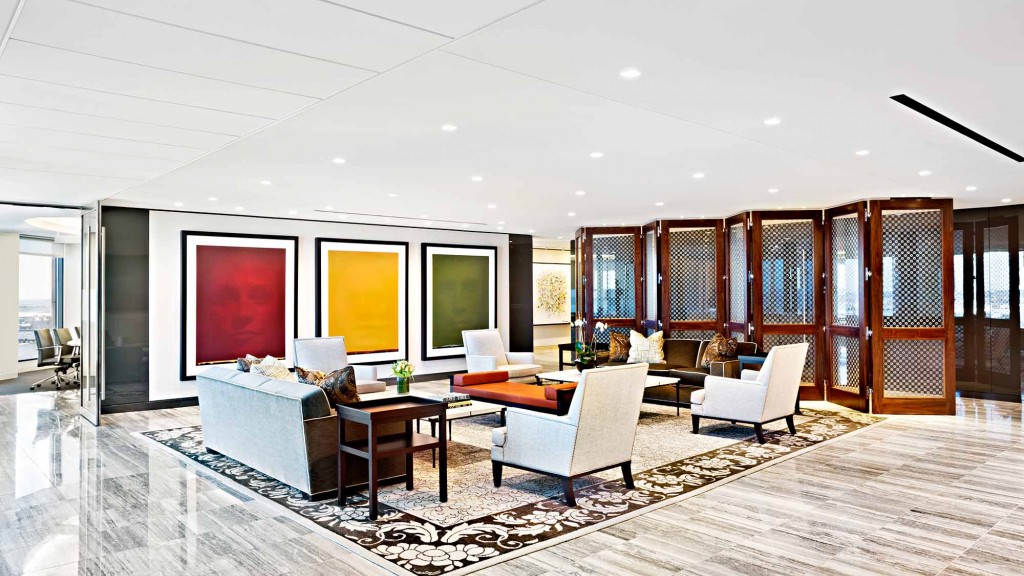 A living room with a large glass wall.