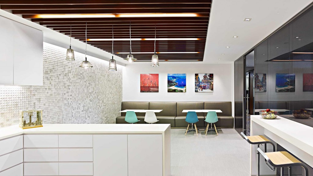 A room with white cabinets and tables.