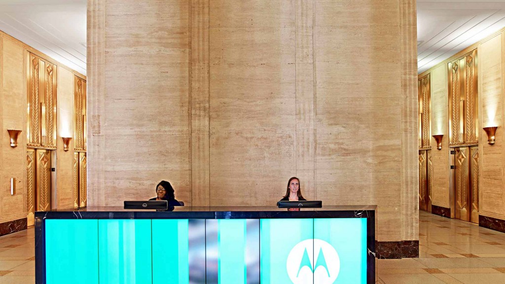 A person sitting at a podium.