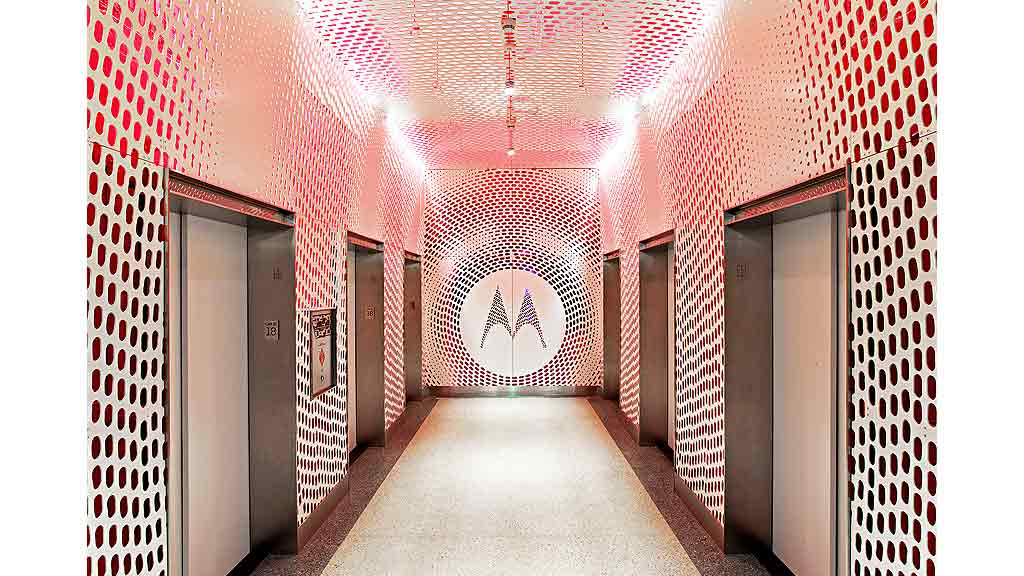 A hallway with doors and a circle in the middle.
