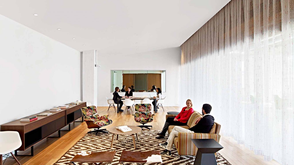 A couple of people sitting in a living room.