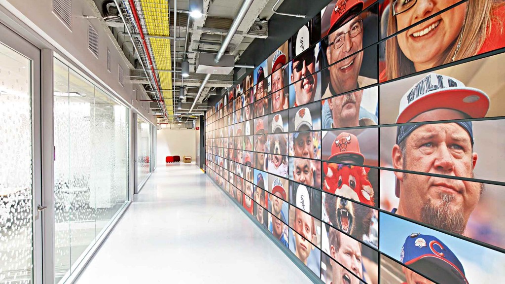 A hallway with a wall of posters.