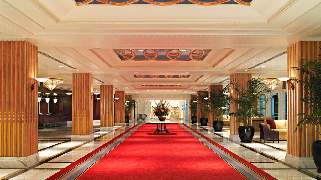 A long red carpet in a building.