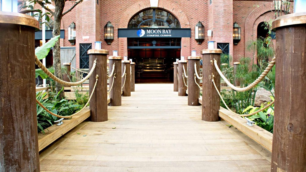 A walkway with a brick building in the background.