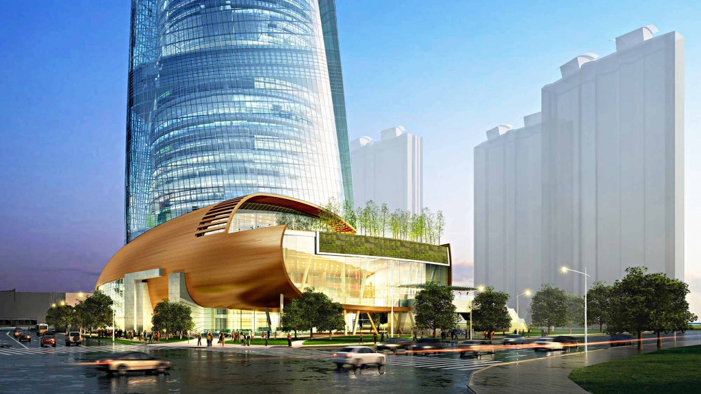 A group of buildings with a river in front of them.