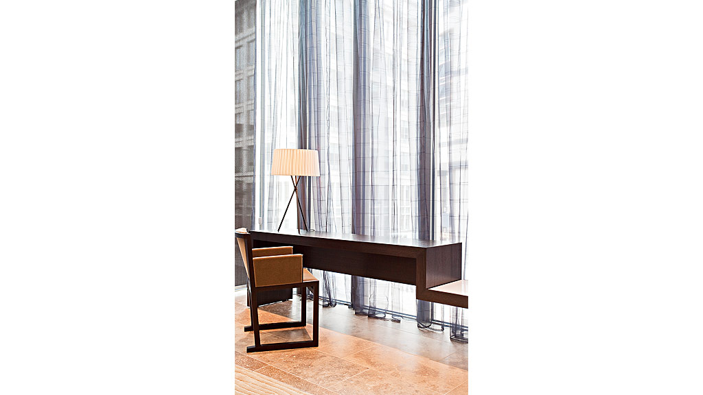 A desk and chair in a room.