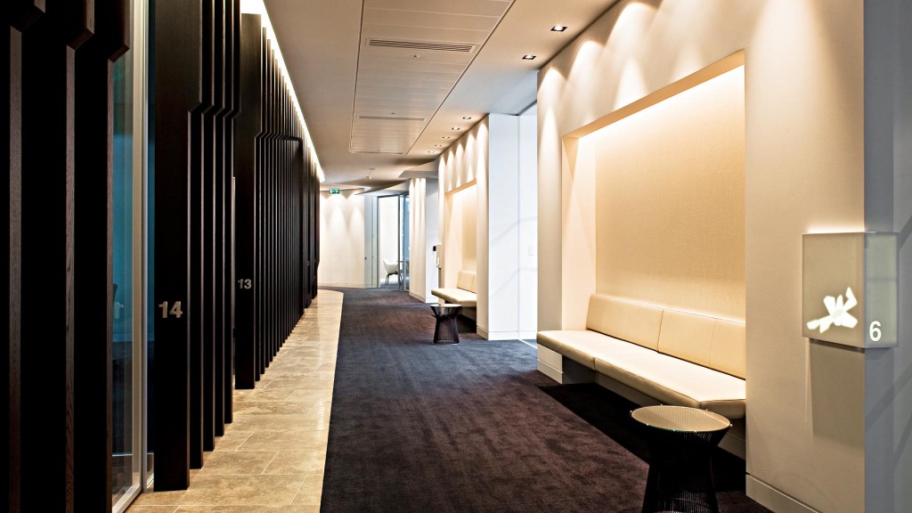 A long hallway with a bench.