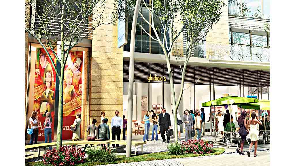 A group of people walking outside of a building.