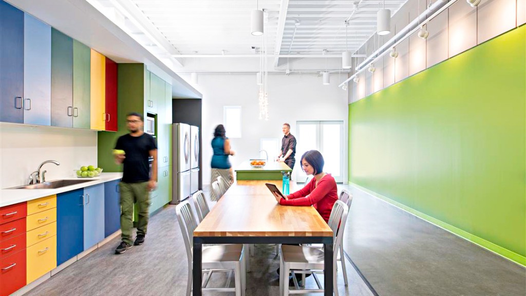 A group of people in a kitchen.