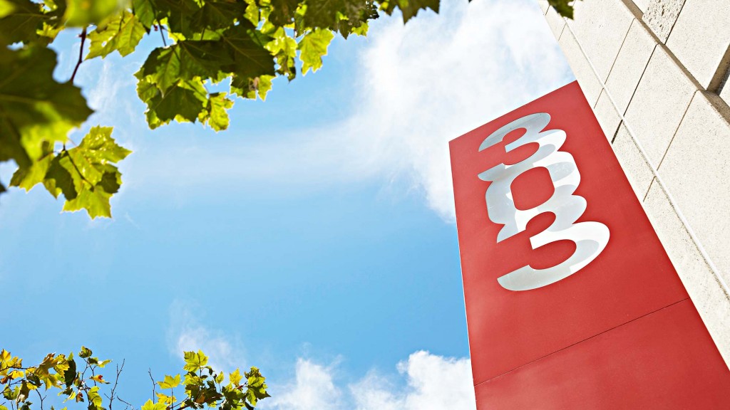 A stop sign with a sticker on it.