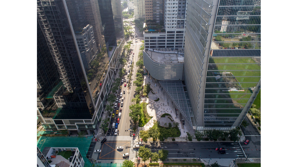 A street with cars and buildings.
