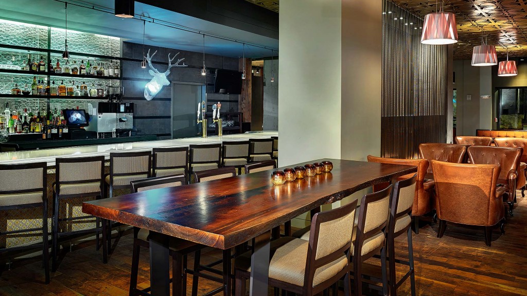 A large dining room with tables and chairs.