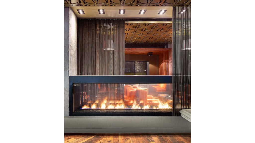 A fireplace with a fire inside.