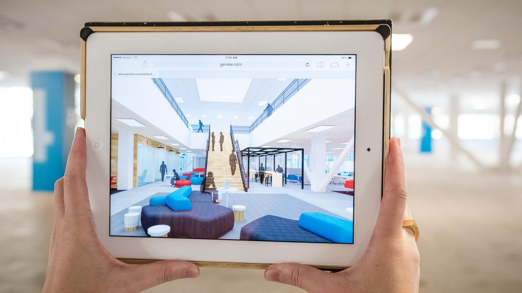 A hand holding a tablet.