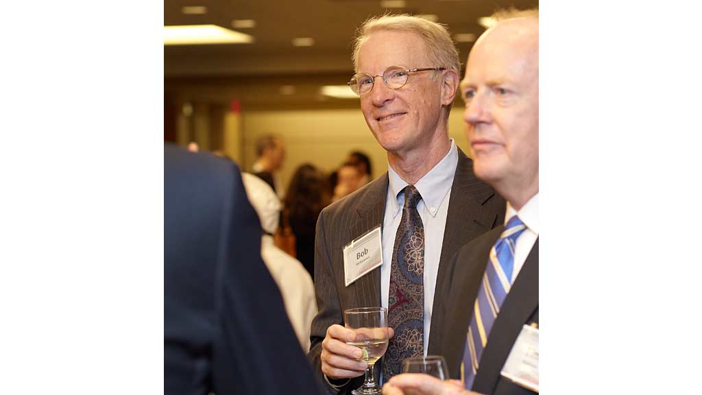 A man holding a glass of wine.