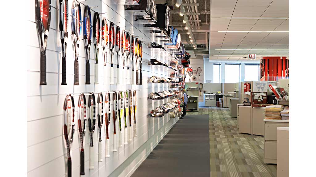 A room with shelves of shoes.