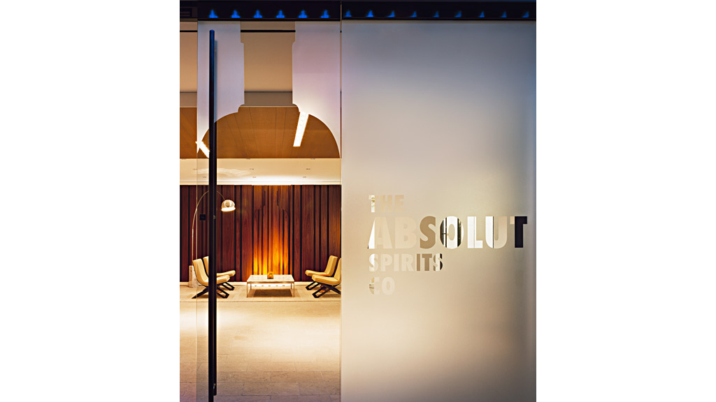 A room with a screen and chairs.