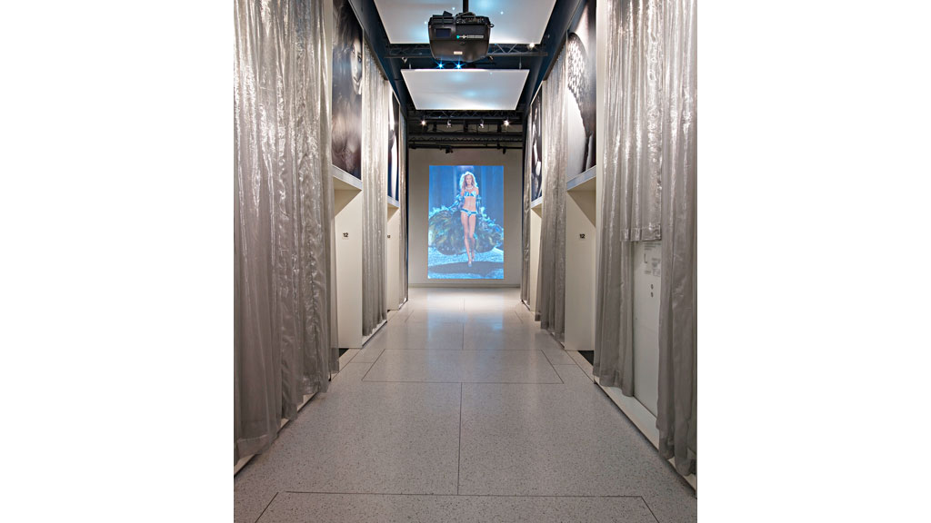 A hallway with a painting on the wall.