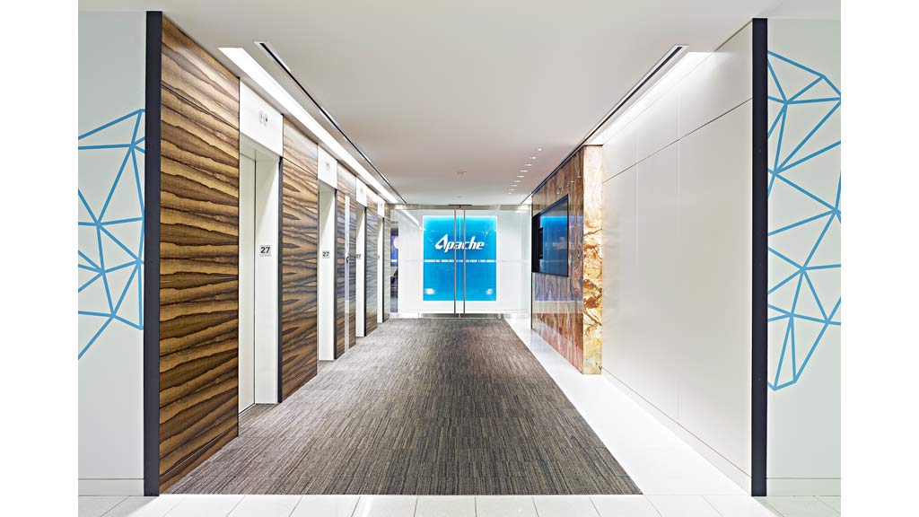 A long hallway with doors.