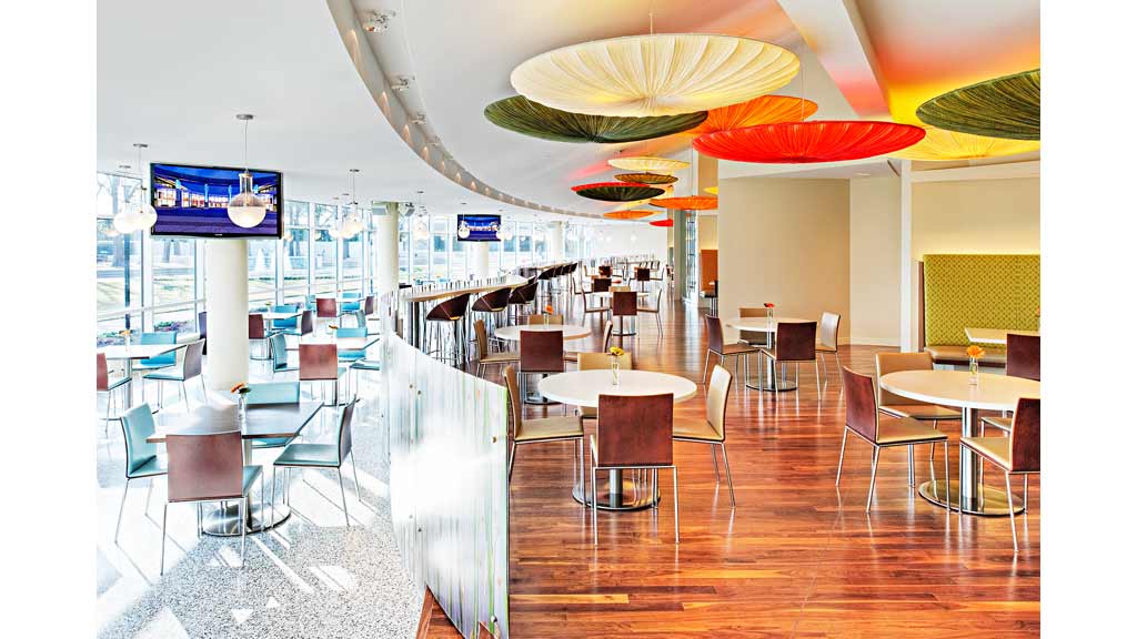 A restaurant with tables and chairs.