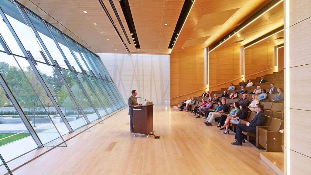 A person giving a lecture to a group of people.
