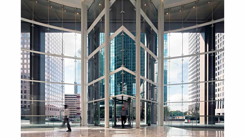 A large glass building with many windows.